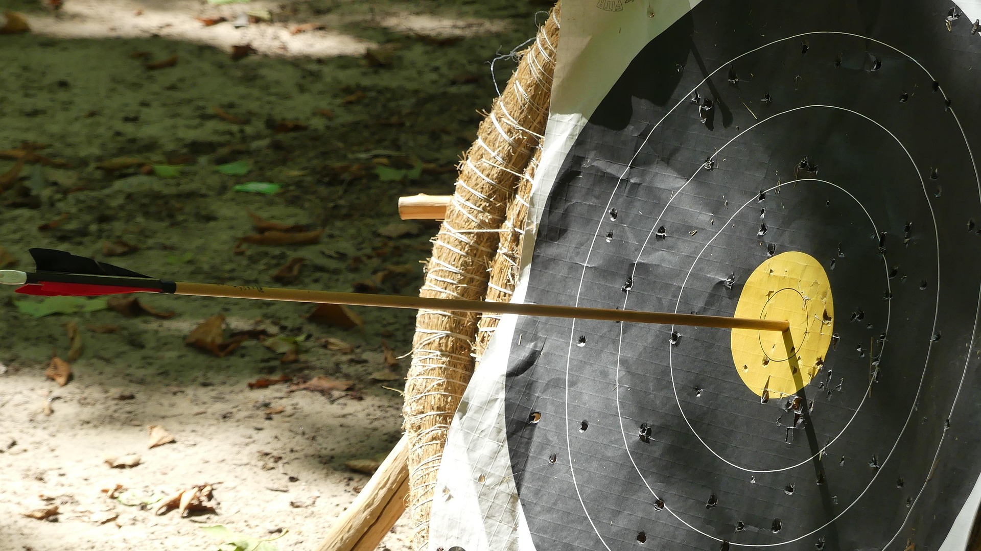 Arrow in the gold ring of a target